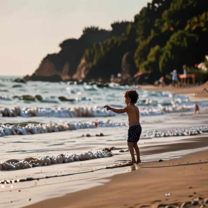 một đứa trẻ đang chơi trên bãi biển